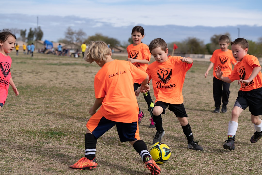services-04 a-group-of-young-children-playing-a-game-of-soccer-3wmeefrdge